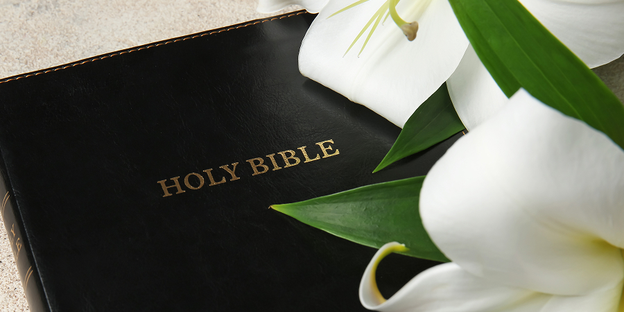 bible with lily flower